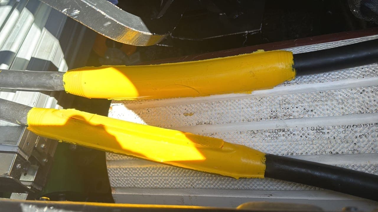 Two Bosworth Flexable Resin cable joints moulded over repaired mining trailing cable, cast in the yellow resin