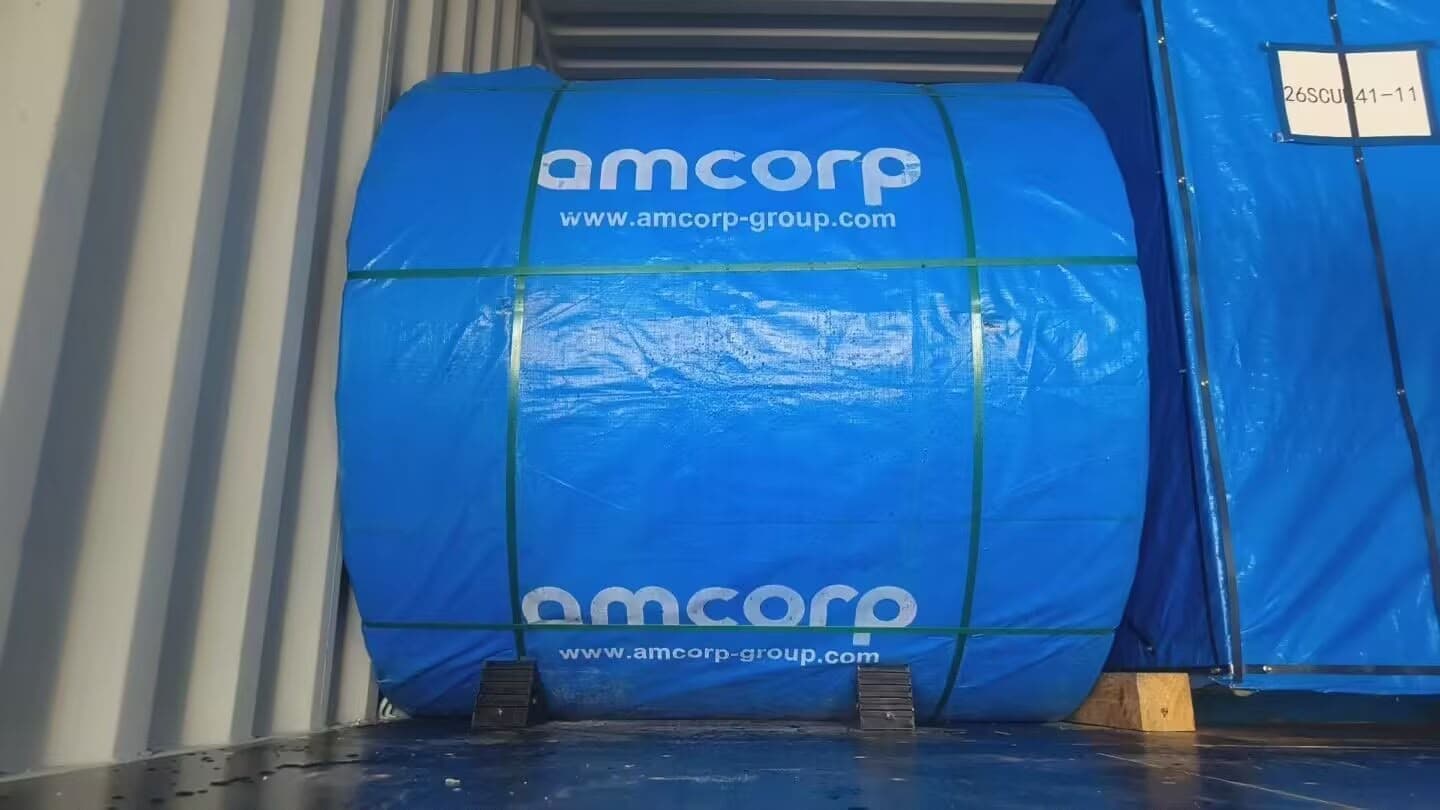 An Amcorp-wrapped roll of Magnum conveyor belting loaded in a shipping container for export to South Africa